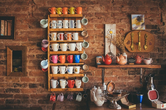mugs on a shelf wall